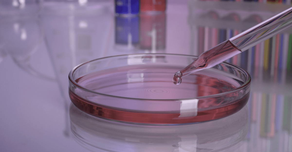 lab EMR integration concept – pipette dropping sample into a petri dish in a clinical lab, symbolizing automated orders and results exchange