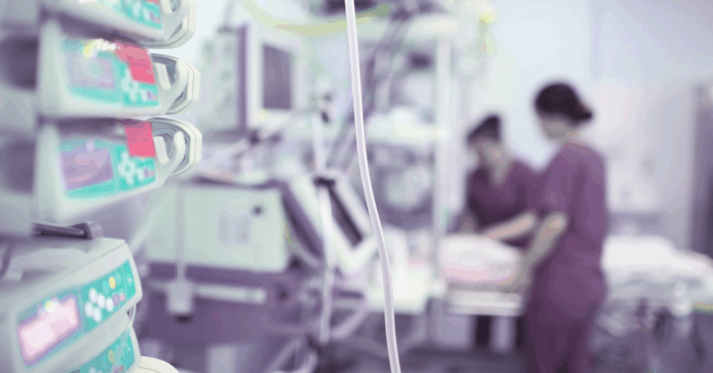 Monitors and infusion pumps in a hospital room – EHR integration in healthcare embedding workflows so clinicians stay in context.