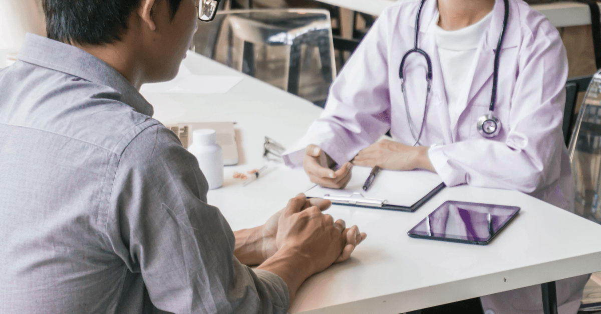 Patient consult at a clinic – RCM integration in healthcare streamlining prior authorization, eligibility checks, and denials handling.